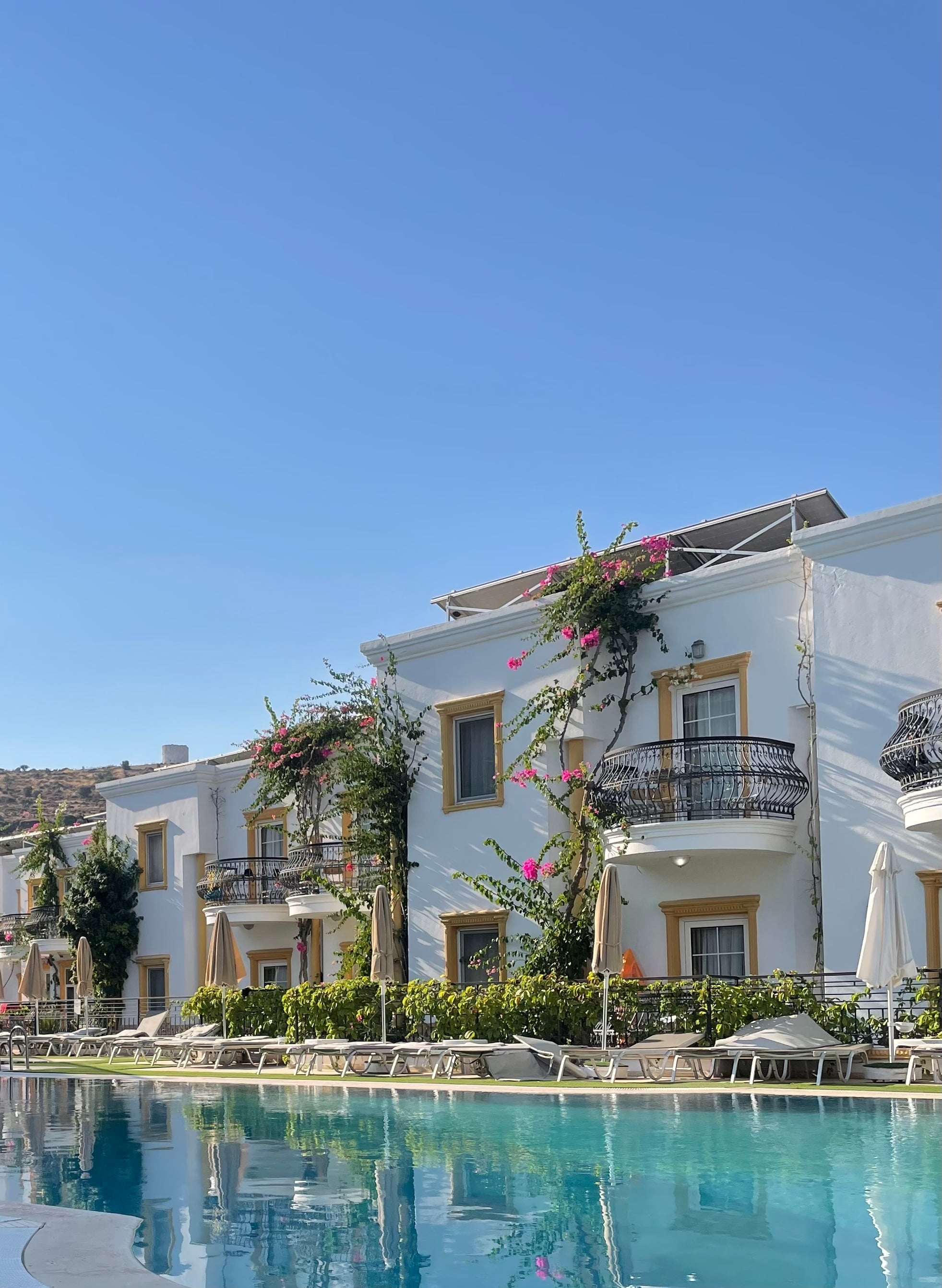 Poolside hotel with blue water